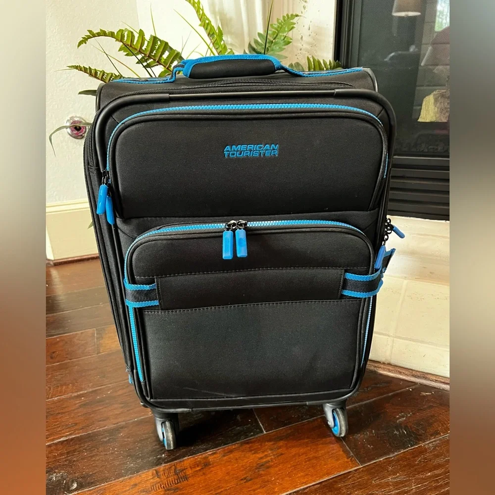 American Tourister Black and Blue Carry-On Spinner Suitcase